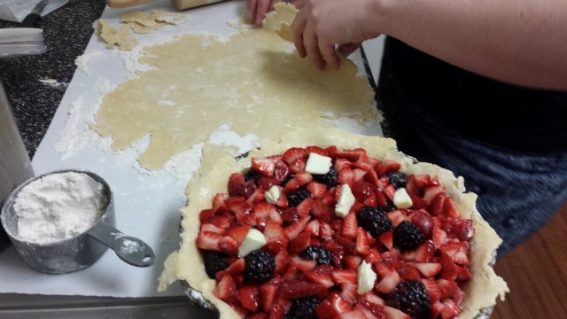 Then start to fold the top crust in half