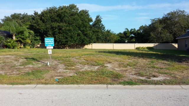 The stucco wall separates the housing development from the bike trail