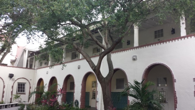 Two levels of outdoor hallways, taken from the courtyard