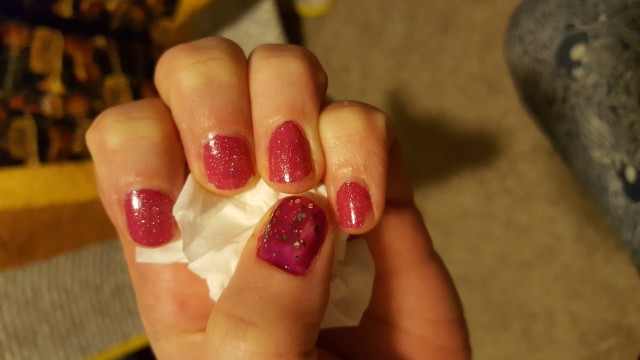 Just paint the bare thumb with a slightly different color pink and a way different glitter. It's fine