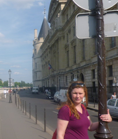 Holding onto this street lamp for support. I remember being so tired this day that I couldn't even smile for this picture. You can see I am trying, but failing to smile.